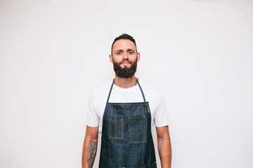 Portrait of a happy young crazy chef cook isolated on a white background