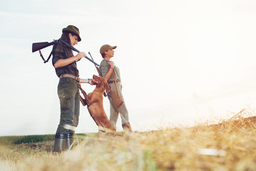 Women hunters with hunting dog 