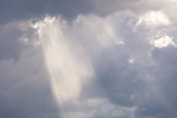 Obraz premium Vivid sunbeam light ray from clouds