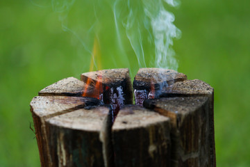Beautiful countryside summer celebration view of burning wood from middle.