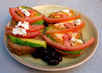 Toast with avocado and tomato, on whole wheat bread