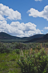 The wide open sagebrush filled desert valley in the utah countryside.