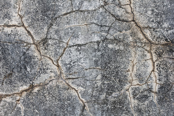 Crack stone texture. Concrete grey  wall with a crack on it.