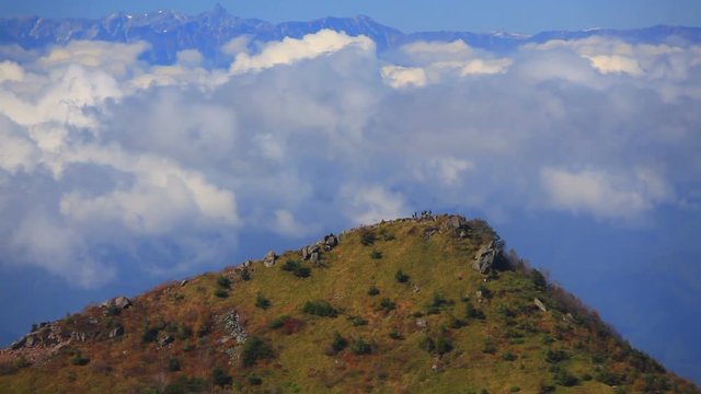 Mount Yuhata summit with hikers,  Tomi,  Nagano Prefecture,  Japan