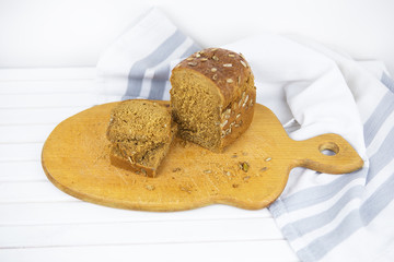 Top view of sliced wholegrain bread on a wooden table