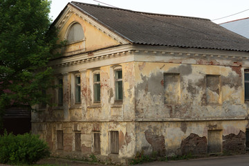 Fototapeta na wymiar old stone house in russian provincial town at sunset concept of dying small russian towns