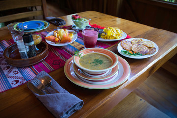 Healthy and organic lunch with lentils soup, fresh fruits and vegetables
