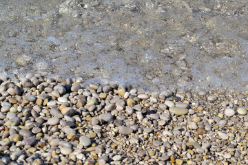 Abstract beach background texture with pebbles, sands and sea water in bodrum turkey
