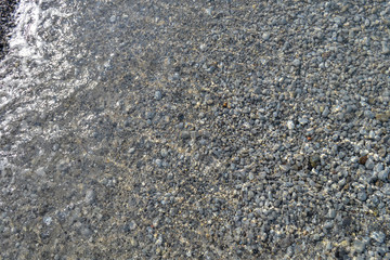 Sea pebbles. Small stones gravel texture background. Pile of pebbles, thailand.Color stone in background.