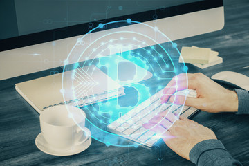 Blockchain theme hud with businessman working on computer on background. Concept of crypto chain....