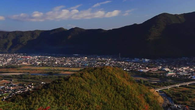 Panning shot of Chikuma city river and Mount Takatsuma,  Japan