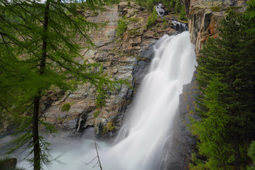 Fototapeta na wymiar Lillaz waterfall among rocks, Aosta Valley, Italy