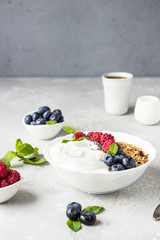 Natural greek yogurt, homemade granola and fresh berries (blueberries and raspberries). 