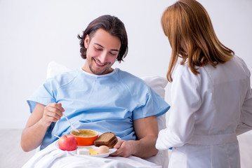 Male patient eating food in the hospital