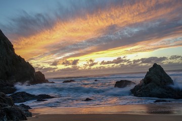 sunset on coast of sea