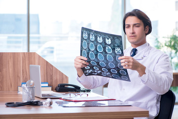 Young male doctor radiologist working in the clinic