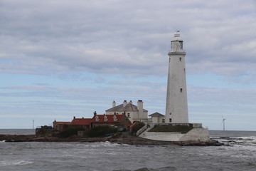 Large white lighthouse on an island 