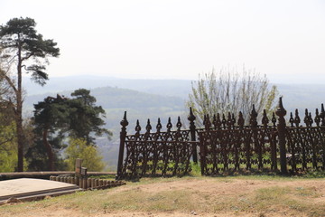 Iron railings in a graveyard on a hill in summer