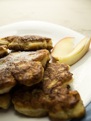 Close up of crepe with apples against white background