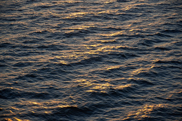 sunset above ocean while cruising through sea