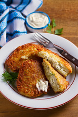 Potato Pancakes Filled With Cheese. Vegetable fritters stuffed with cottage cheese