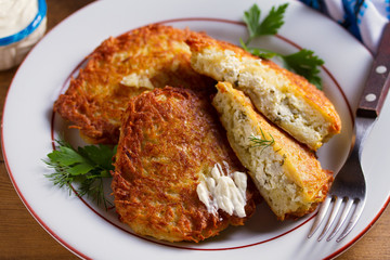 Potato Pancakes Filled With Cheese. Vegetable fritters stuffed with cottage cheese