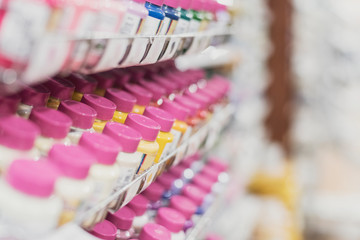 paints bottles in store in a row