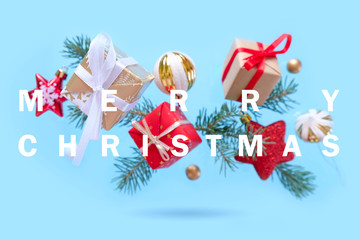 Christmas background with decorations and gift boxes on blue background