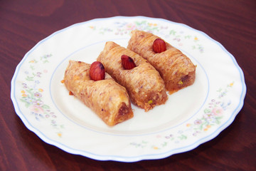 traditional Turkish Arabian oriental sweetness baklava on white plate