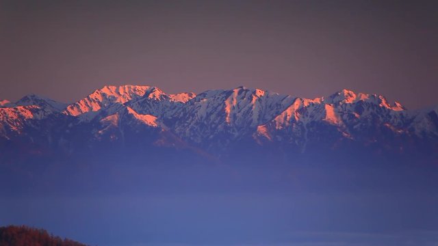 Panning shot of Japanese Northern Alps at sunrise
