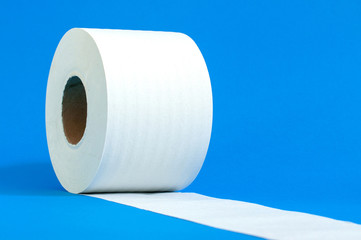 a roll of white toilet paper on a blue background