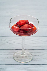 frozen strawberry with sugar in a glass