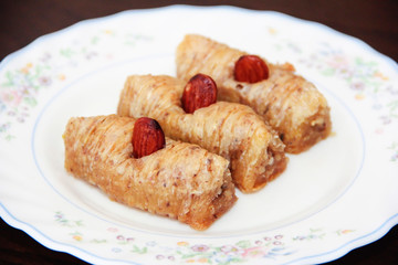 traditional Turkish Arabian oriental sweetness baklava on white plate