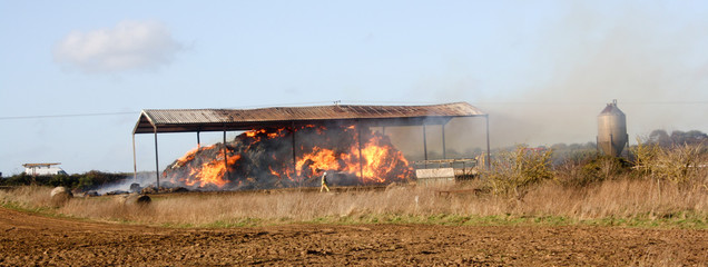 Barn fire full of straw on a farm