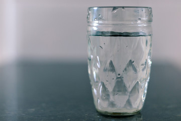 Cup with water on the table