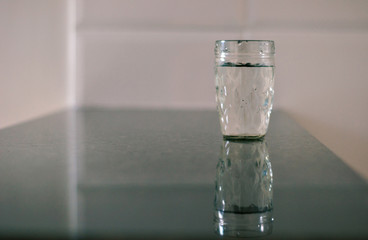 Cup with water on the table