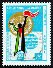 Figure with dove and torch, clothed in Palestinian flag (Kuwait 1979)