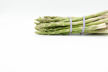 Asparagus surrounded by a medical tape on weighing scale for diets