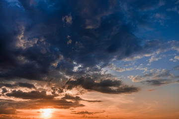 Fototapeta na wymiar Beautiful colorful sunset with cumulus clouds with bird.