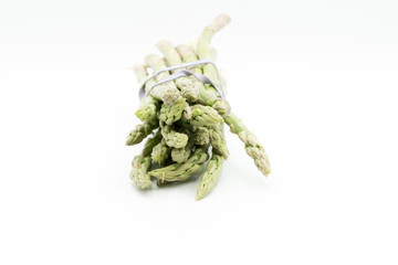 Asparagus surrounded by a medical tape on weighing scale for diets