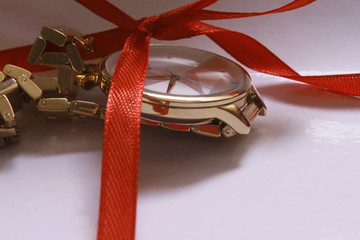 christmas gift with ribbon and bow on red background