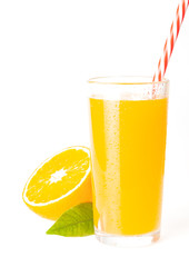 glass jar of fresh orange juice with fresh fruits on dark table