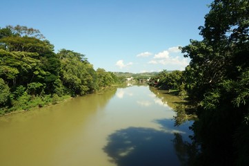 Fototapeta na wymiar Natural River with sky reflection