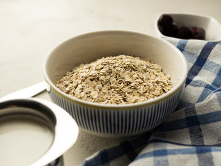 Close up of  porridge with milk and cherries
