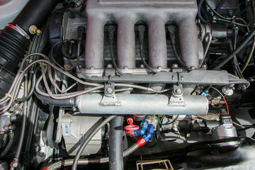 A detail of the sports car engine. It is a historic rallye car from the past. 