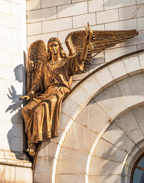 Sculpture of  Archangel Uriel with fire in hand on  temple wall
