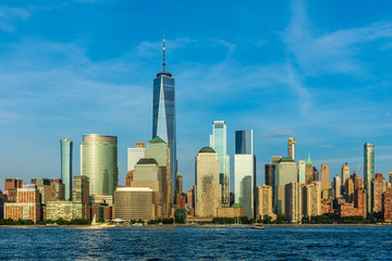 Fototapeta premium View to Lower Manhattan Skyline from Exchange Place in Jersey City at sunset.