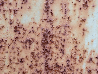Rust on metal. Texture. Corrosion. Swollen rusty surface.