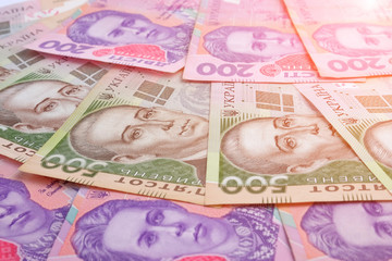 Ukrainian banknotes value of 500 and 200 hryvnia UAH as background.