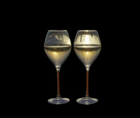 Two champagne flute glasses sunset